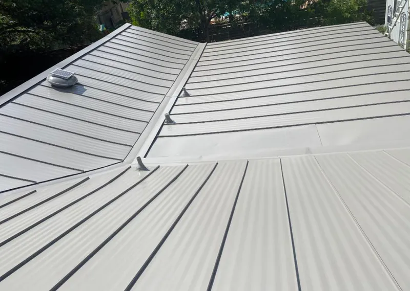 Solar attic fan installed on a metal roof for Roof Ventilation in Fortuna